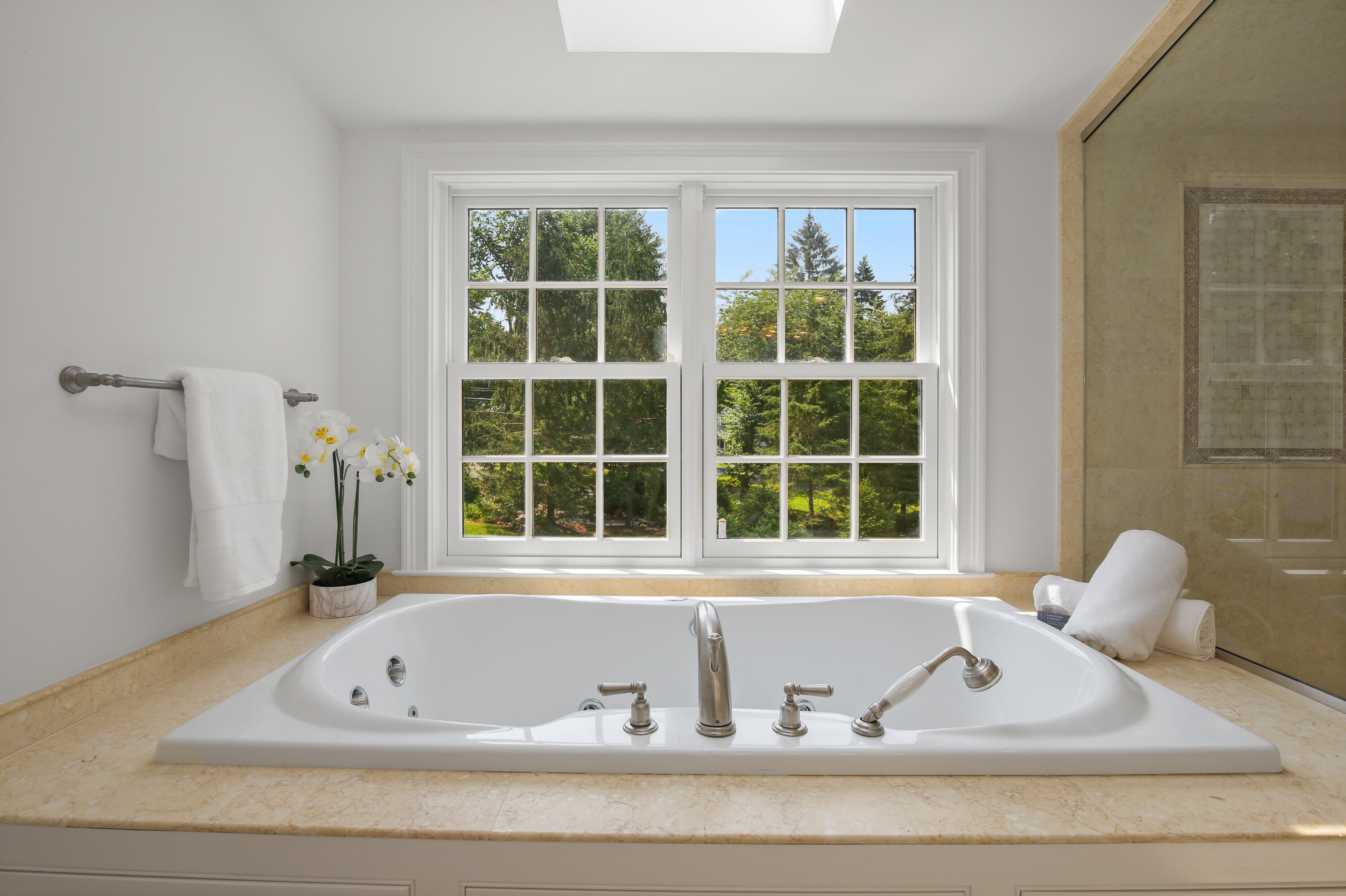 114 Colony Road Darien, CT 06820 - Photo 21 of 40 a view of bath tub sitting in front of a window