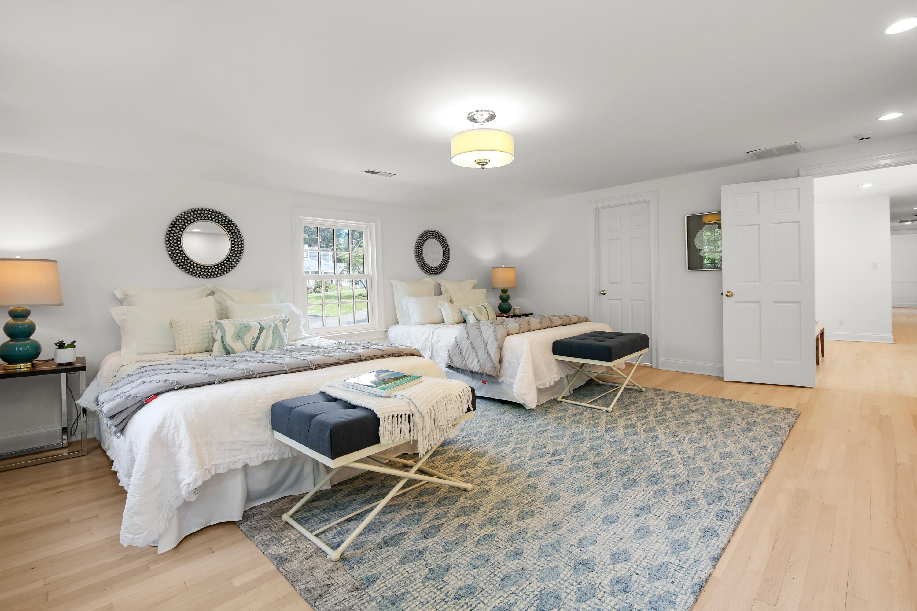 114 Colony Road Darien, CT 06820 - Photo 22 of 40 a bed room with a bed and a lamp
