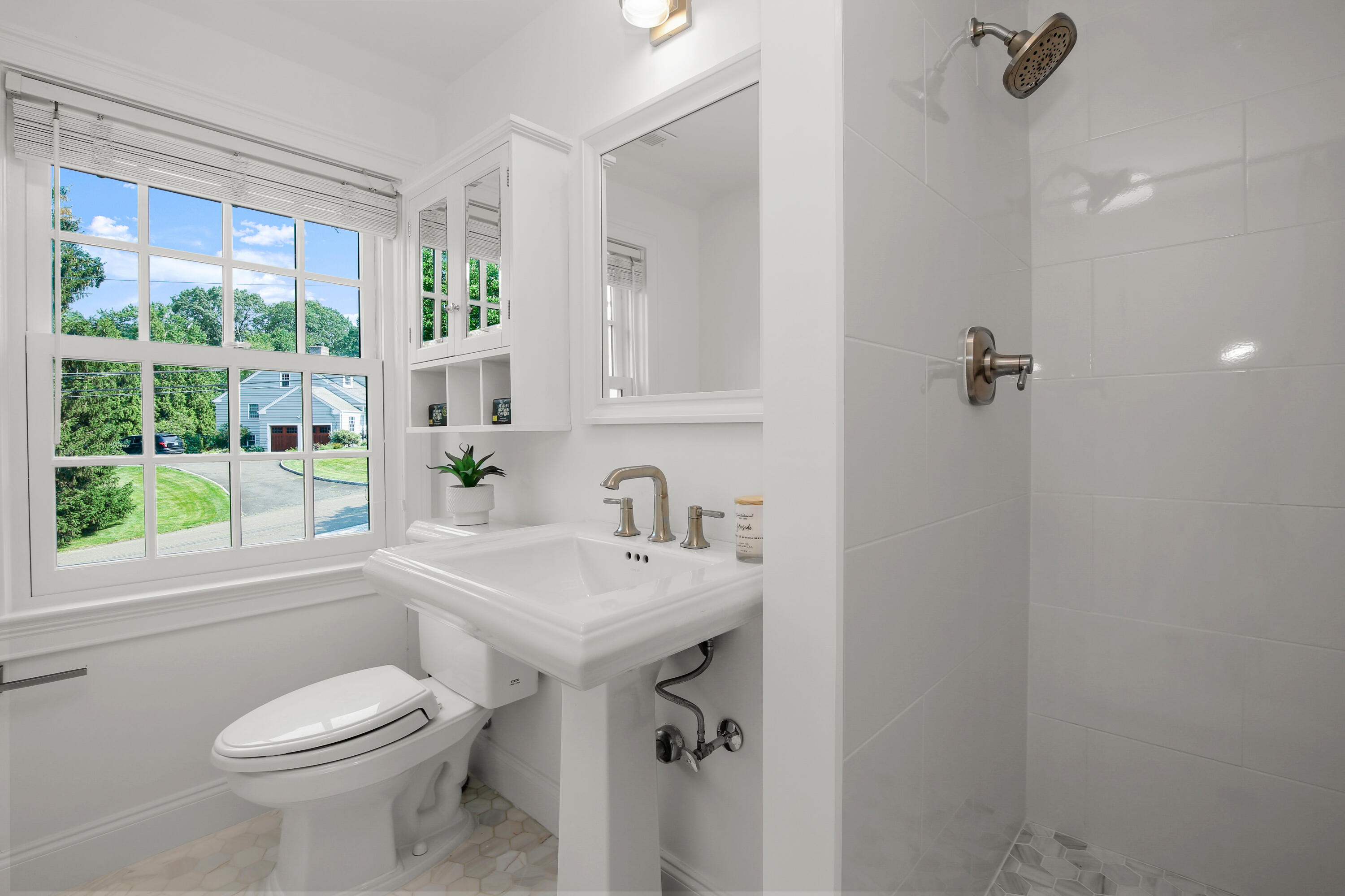 114 Colony Road Darien, CT 06820 - Photo 23 of 40 a bathroom with a sink toilet and shower
