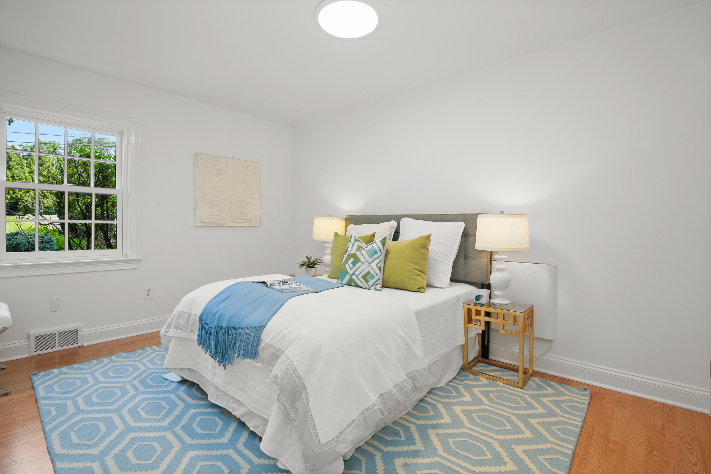 114 Colony Road Darien, CT 06820 - Photo 27 of 40 a bedroom with a bed and a window