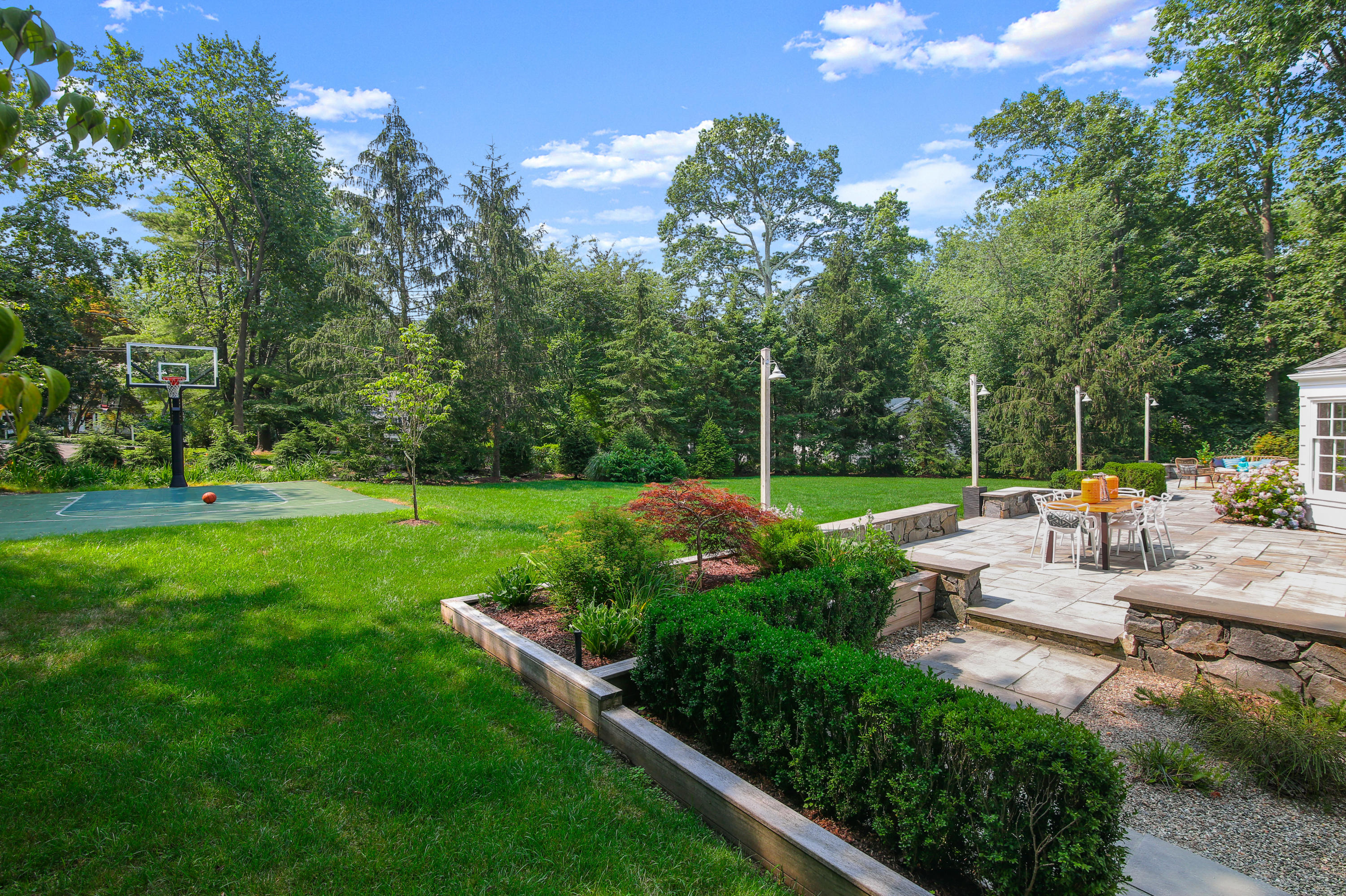 114 Colony Road Darien, CT 06820 - Photo 33 of 40 a view of a garden with lawn chairs