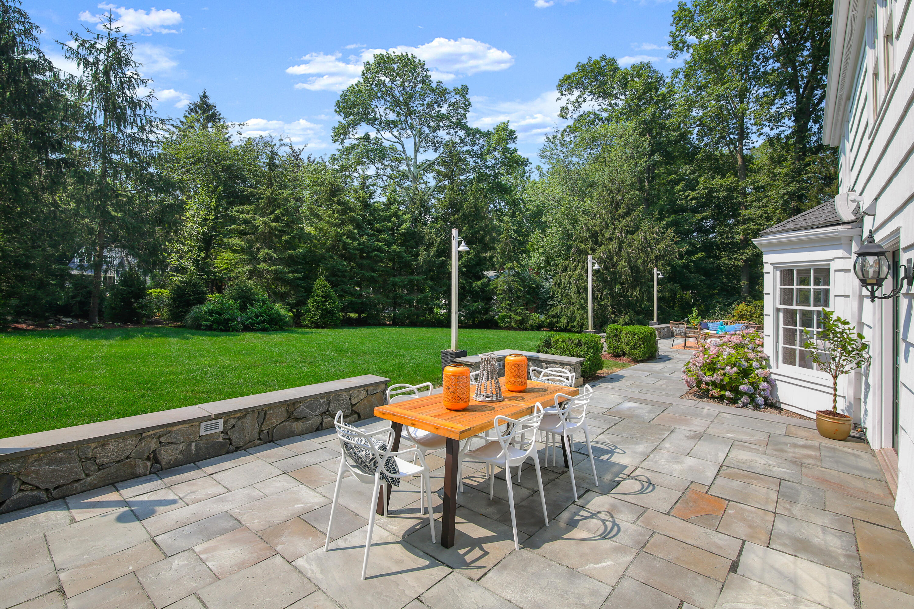 114 Colony Road Darien, CT 06820 - Photo 10 of 40 a view of a chair and tables in the garden