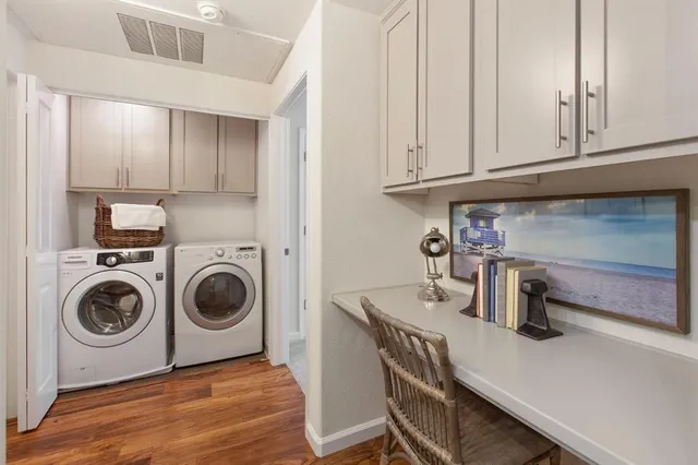 a utility room with sink dryer and washer