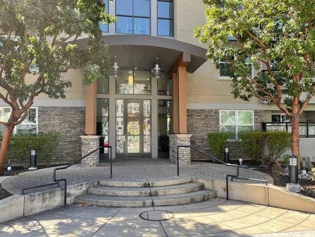 a front view of a house with outdoor seating