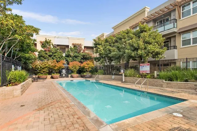 a view of a swimming pool with a patio