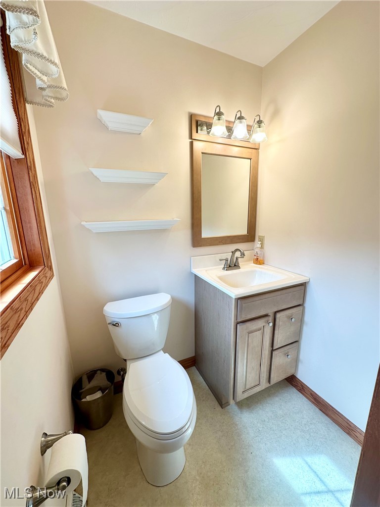 4461 Cross Creek Road Colliers, WV 26035 - Photo 25 of 33 Half bathroom with vanity and toilet