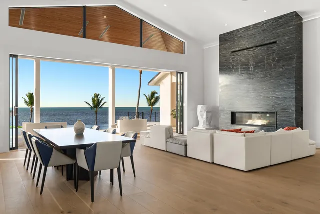 a bathroom with a bathtub a double vanity sink and mirror
