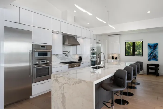 a bedroom with a bed lamp and window