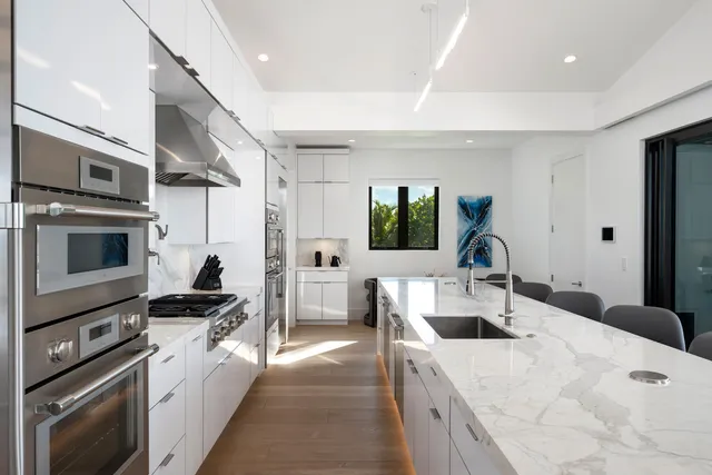 a bedroom with a bed and large window