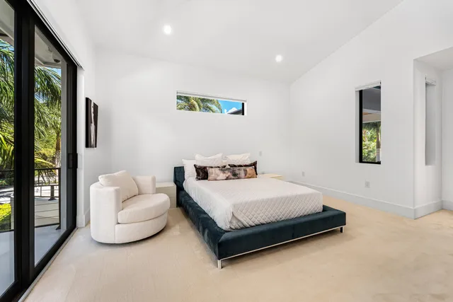 an aerial view of a house with a yard and potted plants