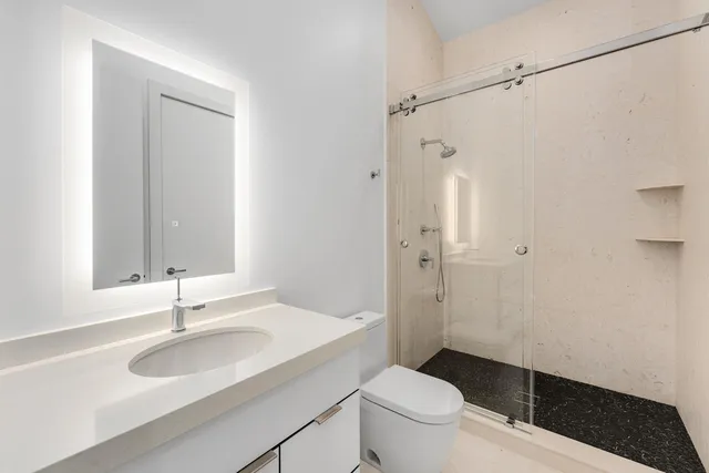 an aerial view of a house with a yard and a garden