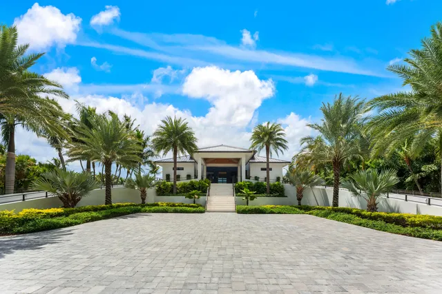 a kitchen with stainless steel appliances kitchen island granite countertop a stove and cabinets