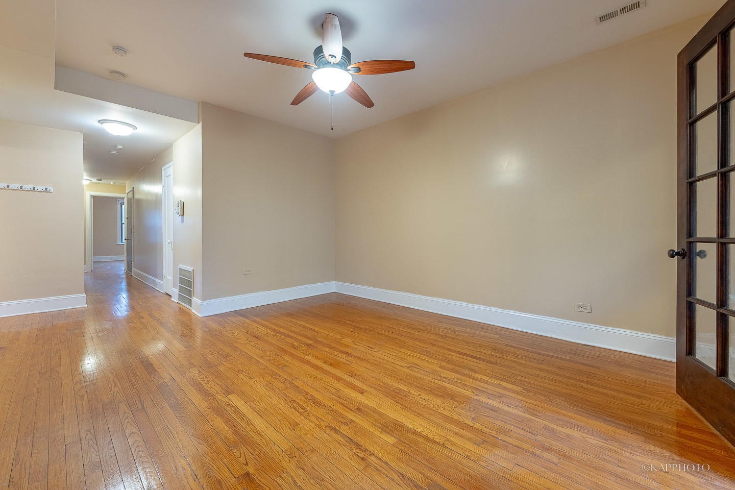 6819 South Ridgeland Avenue, Unit 2 Chicago, IL 60649 - Photo 12 of 27 a view of empty room with wooden floor and fan