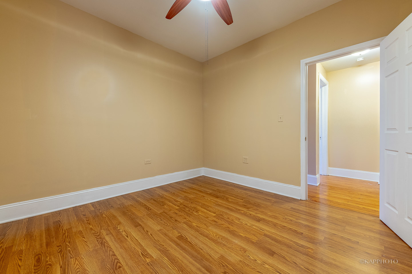 6819 South Ridgeland Avenue, Unit 2 Chicago, IL 60649 - Photo 18 of 27 wooden floor in an empty room