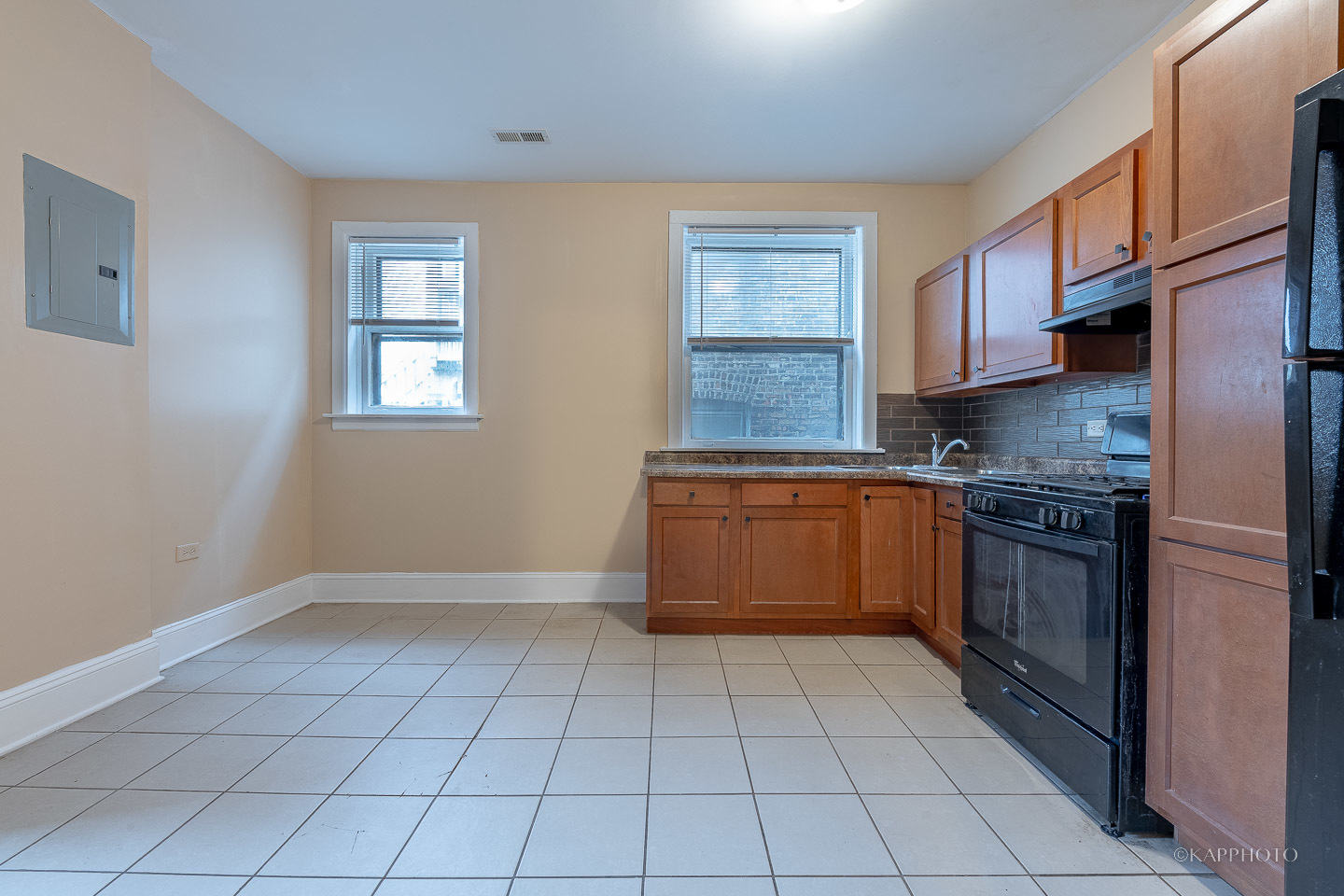 6819 South Ridgeland Avenue, Unit 2 Chicago, IL 60649 - Photo 5 of 27 a kitchen with a stove a sink dishwasher and a microwave oven