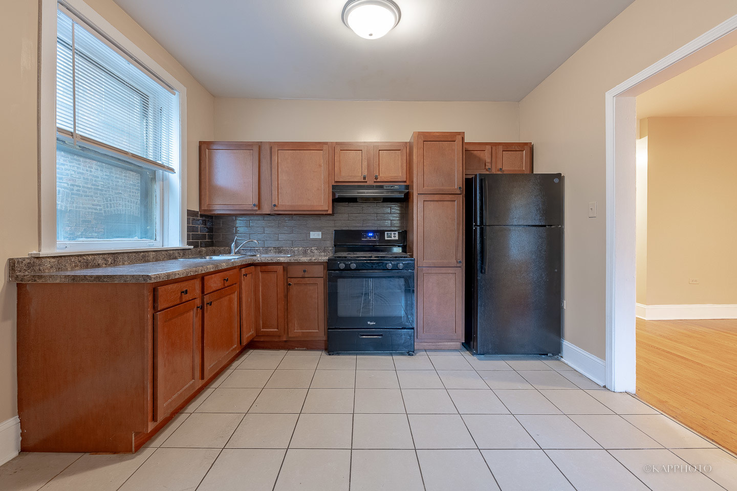 6819 South Ridgeland Avenue, Unit 2 Chicago, IL 60649 - Photo 7 of 27 a kitchen with stainless steel appliances granite countertop a refrigerator and a stove top oven