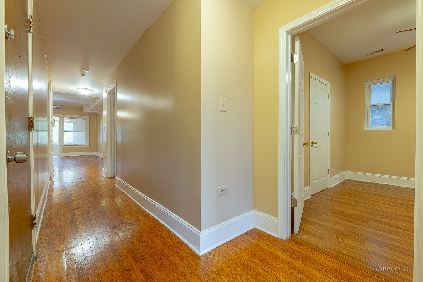 6819 South Ridgeland Avenue, Unit 2 Chicago, IL 60649 - Photo 9 of 27 a view of a hallway with wooden floor