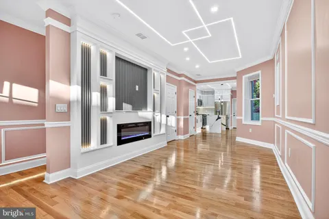 a view of a livingroom hardwood floor and living room