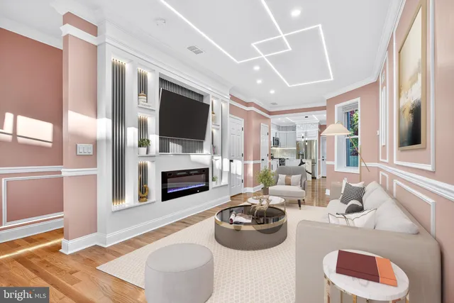 a living room with furniture a fireplace and a flat screen tv