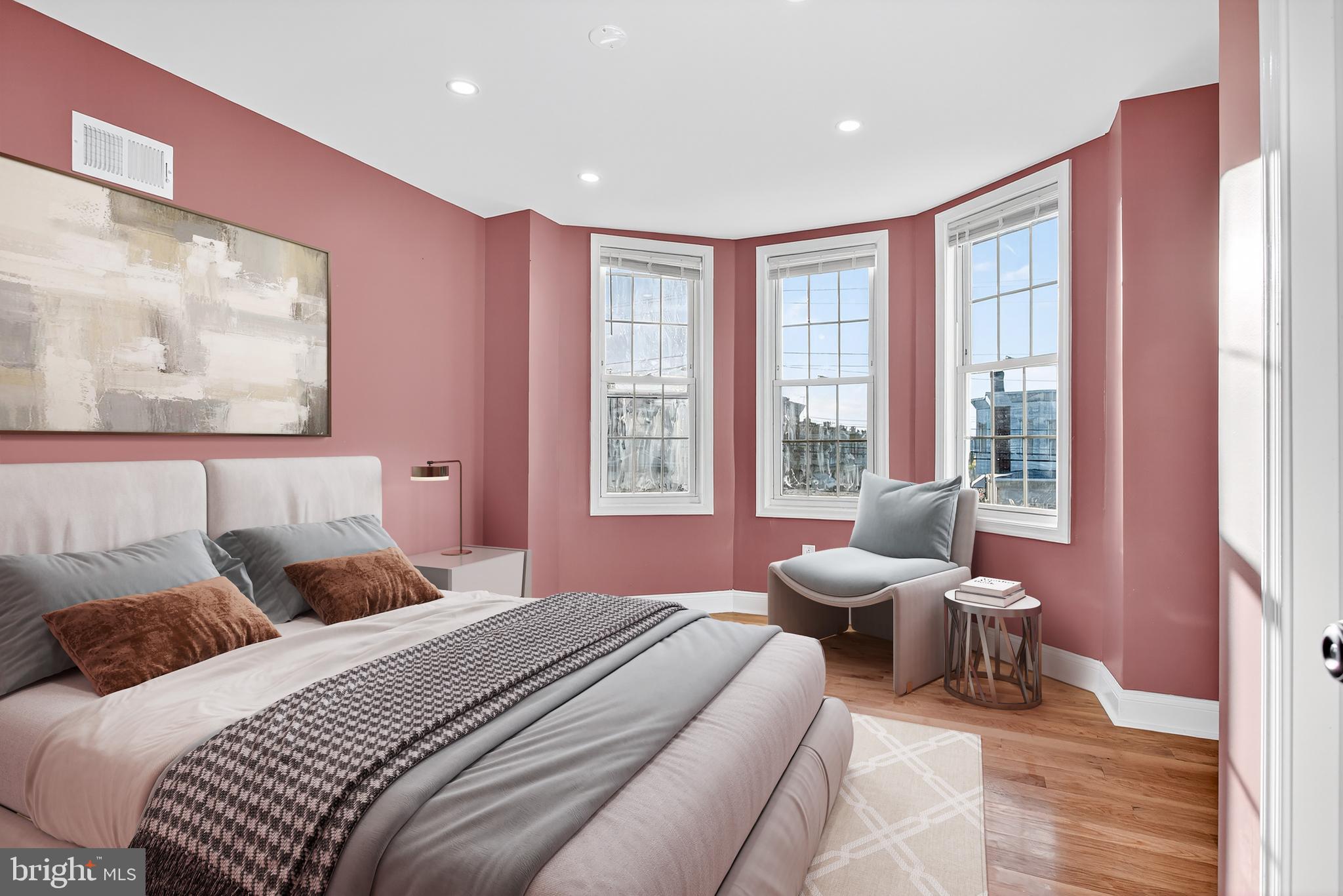 5421 Kingsessing Avenue Philadelphia, PA 19143 - Photo 2 of 39 a bedroom with a bed and glass windows