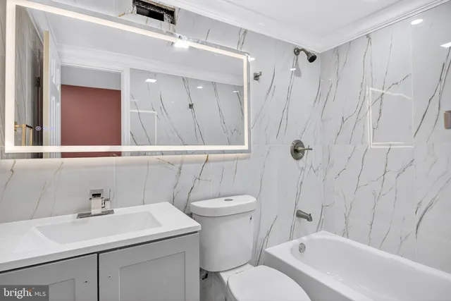 a view of a building with wooden fence and trees