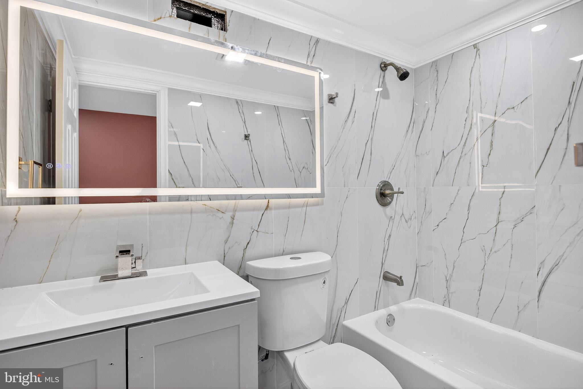 5421 Kingsessing Avenue Philadelphia, PA 19143 - Photo 36 of 39 a bathroom with a sink a toilet and shower