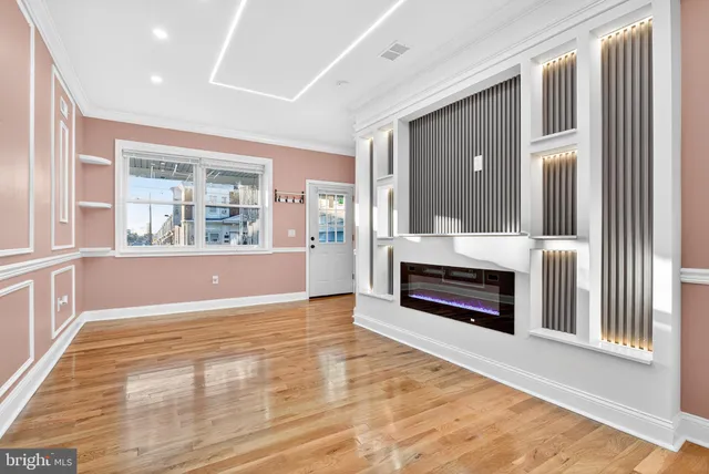 a living room with a fireplace and a window