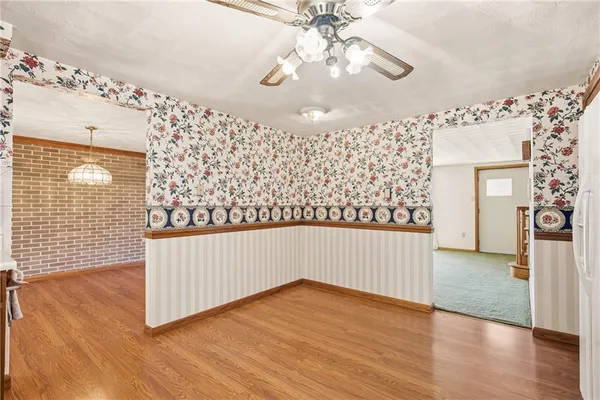 a kitchen with stainless steel appliances granite countertop a stove and a refrigerator
