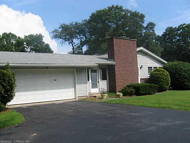 1092 Flanders Road Groton, CT 06355 - Photo 1 of 1 a front view of a house with a garden and garage