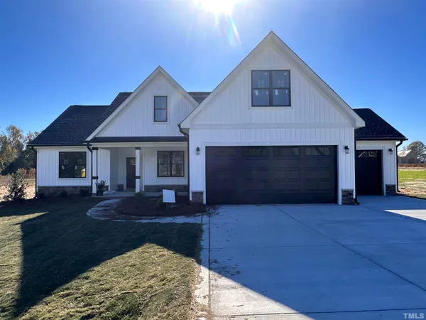 a front view of a house with yard