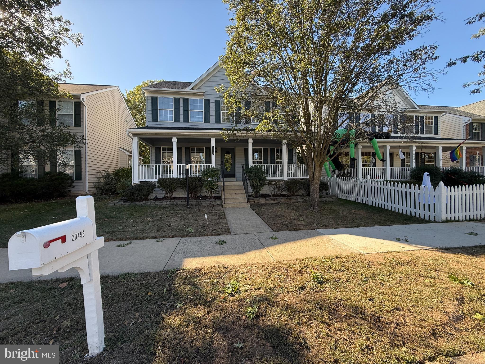 20453 Charter Oak Drive Ashburn, VA 20147 - Photo 1 of 31 front view of a house with a yard
