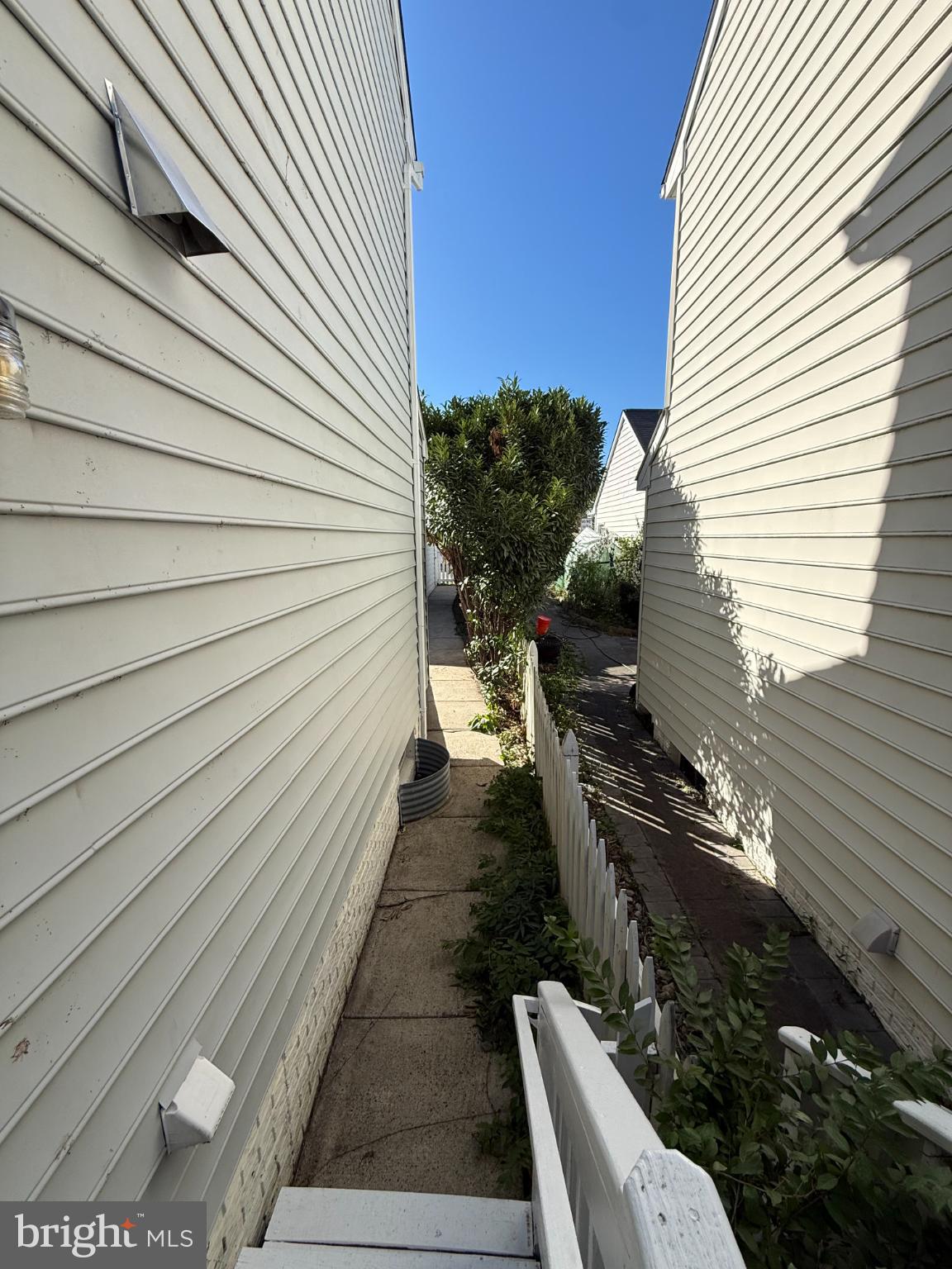 20453 Charter Oak Drive Ashburn, VA 20147 - Photo 11 of 31 a view of a balcony with chairs and wooden floor