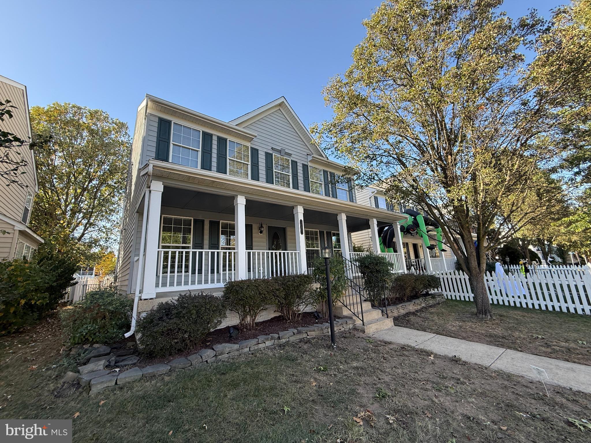 20453 Charter Oak Drive Ashburn, VA 20147 - Photo 2 of 31 a front view of a house with a yard
