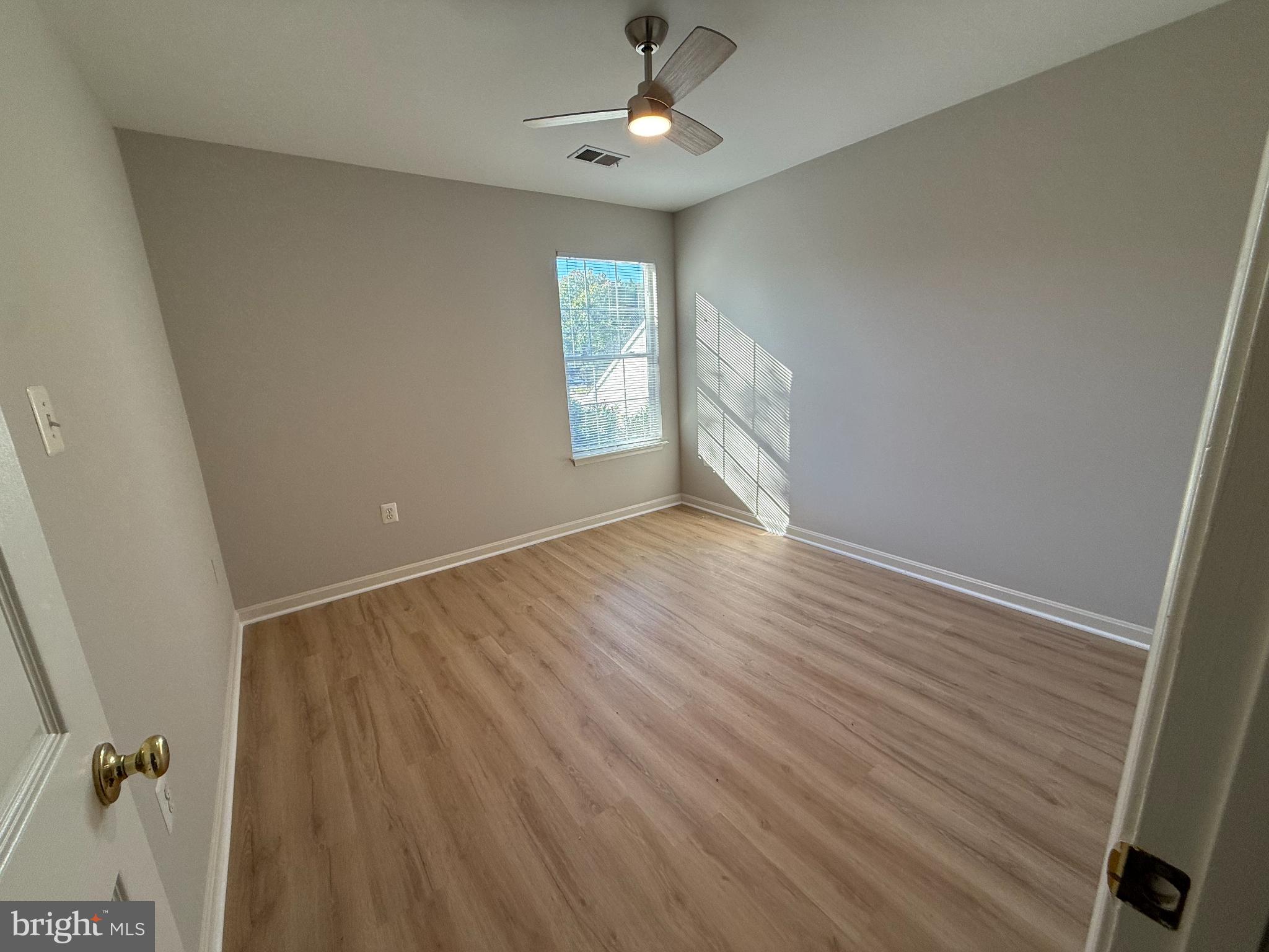 20453 Charter Oak Drive Ashburn, VA 20147 - Photo 25 of 31 wooden floor in an empty room with a window