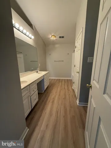 a bathroom with a sink a mirror and a toilet