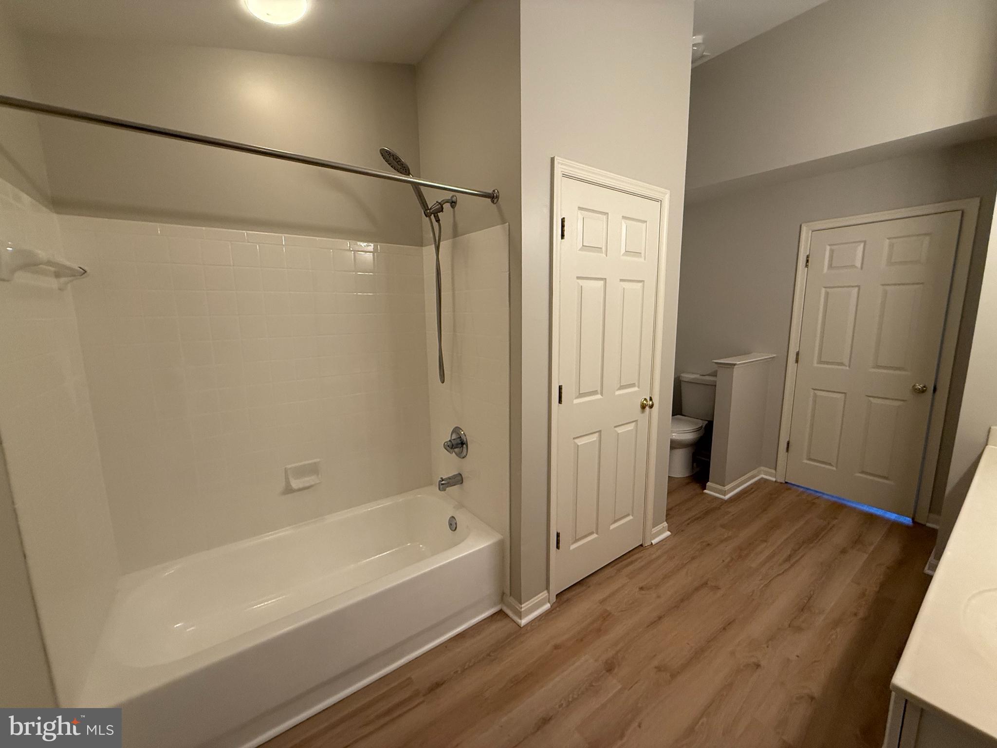 20453 Charter Oak Drive Ashburn, VA 20147 - Photo 6 of 31 a bathroom with a bathtub and a shower