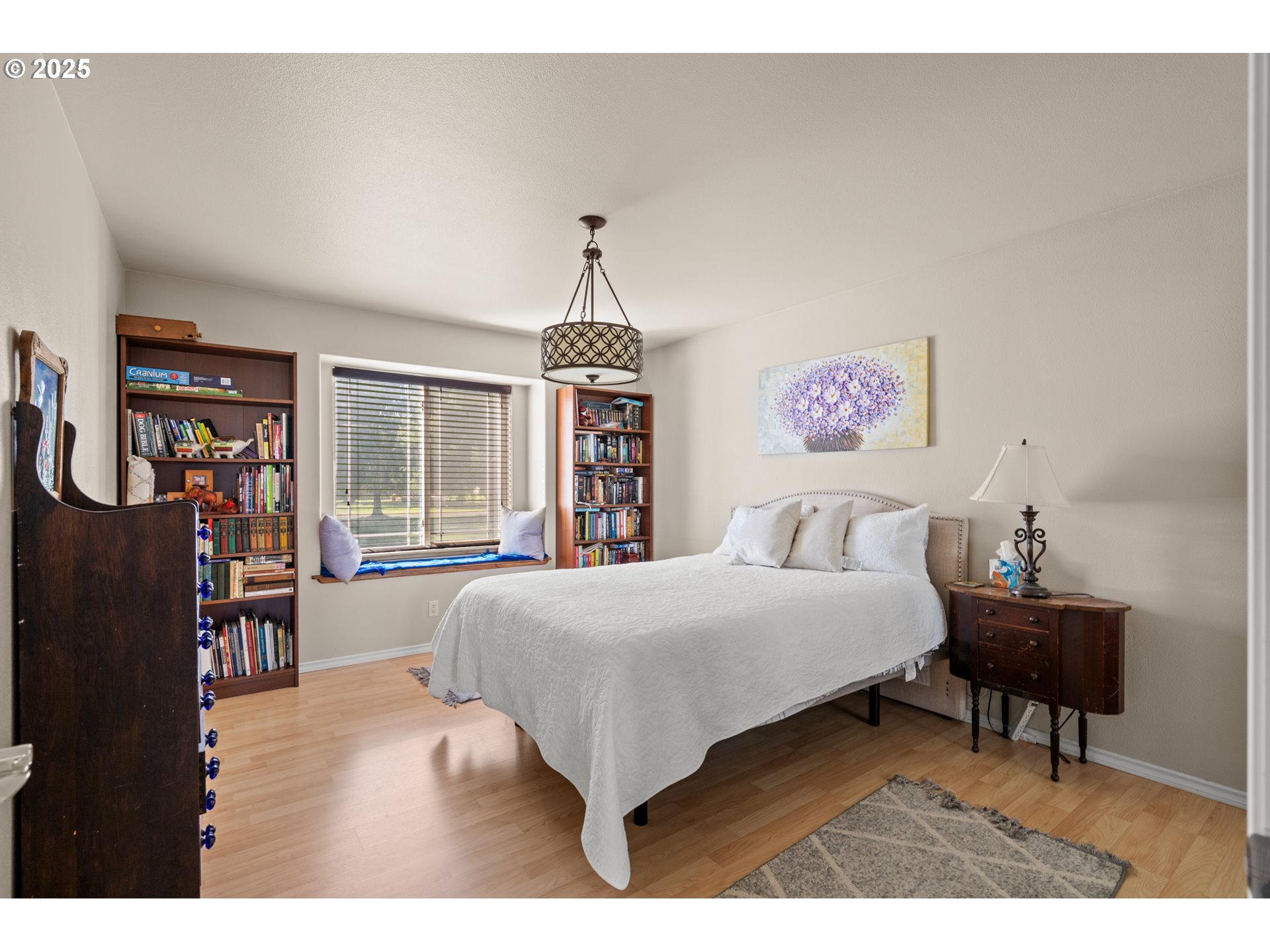 75077 Oregon Lane Irrigon, OR 97844 - Photo 14 of 41 a bedroom with a bed and a chandelier