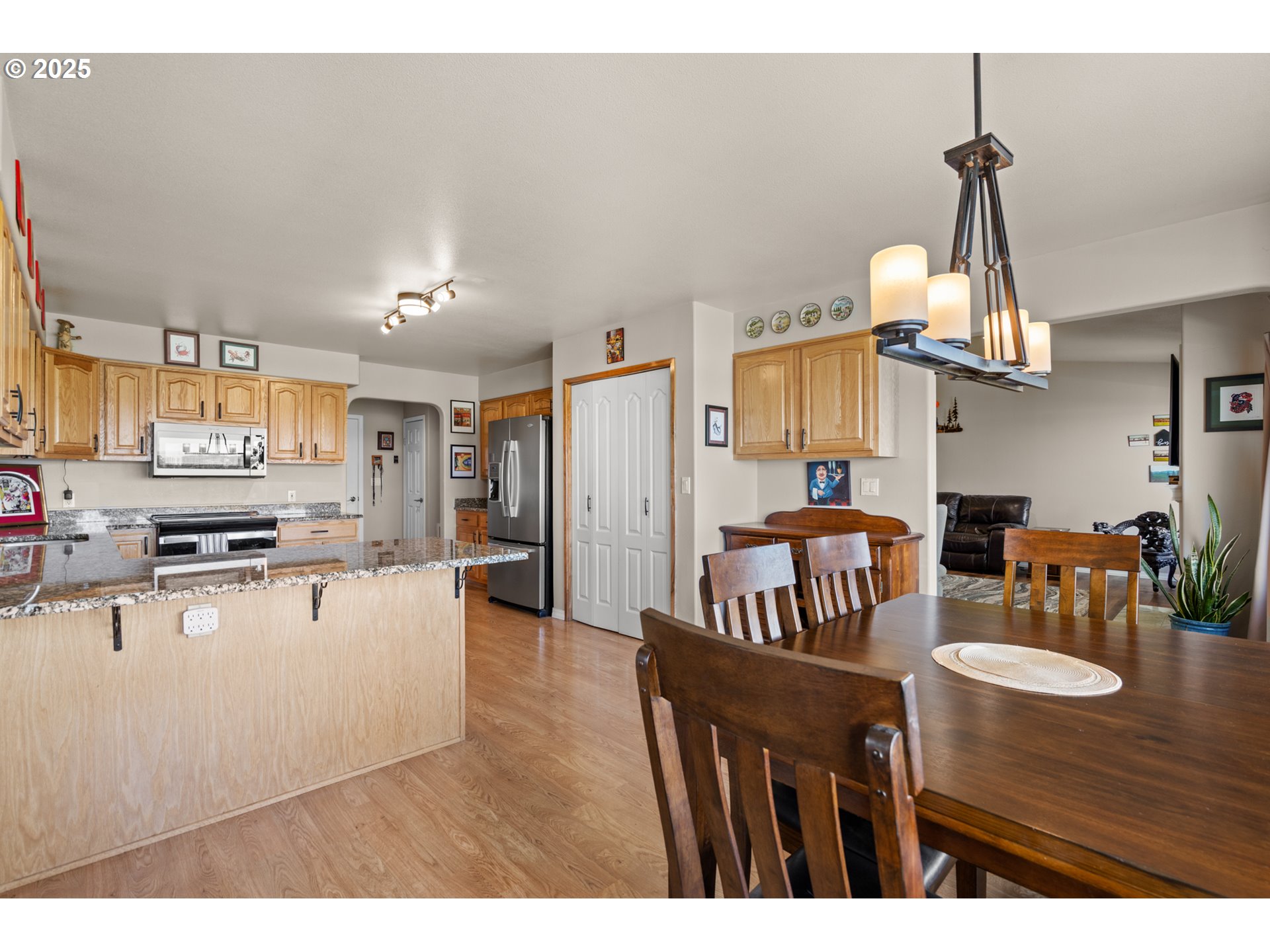 75077 Oregon Lane Irrigon, OR 97844 - Photo 10 of 41 a living room with stainless steel appliances kitchen island granite countertop furniture and a kitchen view