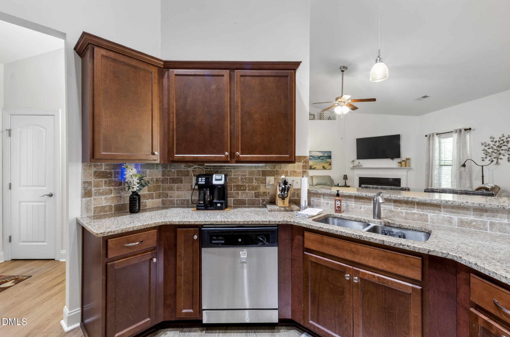 20 Deep Clay Circle Angier, NC 27501 - Photo 23 of 54 a kitchen with stainless steel appliances granite countertop a sink stove and microwave