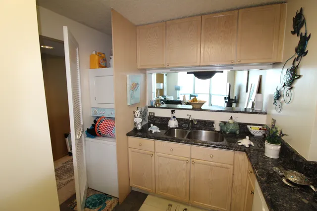 a kitchen with sink cabinets and window