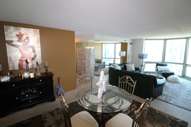 a living room with furniture dining room and a window