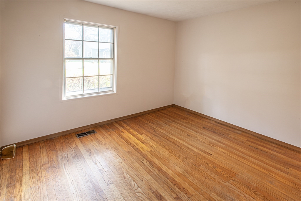 21 Dwight Street Hatfield, MA 01038 - Photo 15 of 24 an empty room with wooden floor and windows