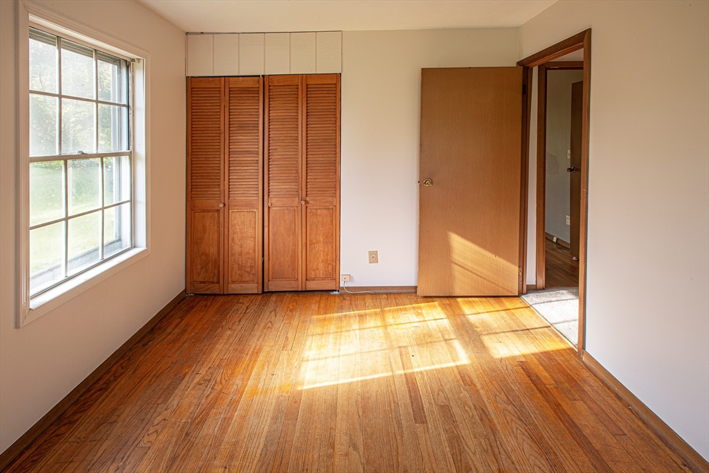 21 Dwight Street Hatfield, MA 01038 - Photo 18 of 24 a view of an empty room with wooden floor and a window