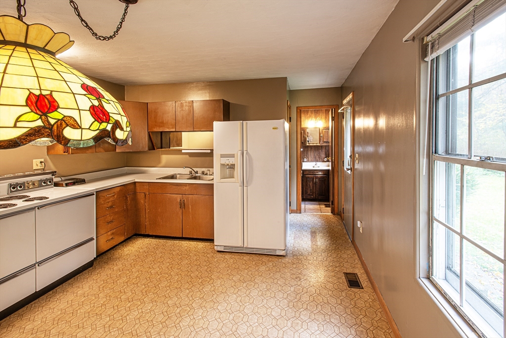 21 Dwight Street Hatfield, MA 01038 - Photo 5 of 24 a kitchen with a refrigerator and a sink