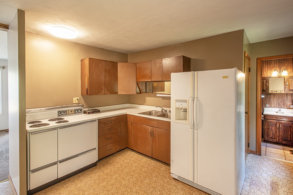 21 Dwight Street Hatfield, MA 01038 - Photo 6 of 24 a kitchen with stainless steel appliances a refrigerator sink and cabinets