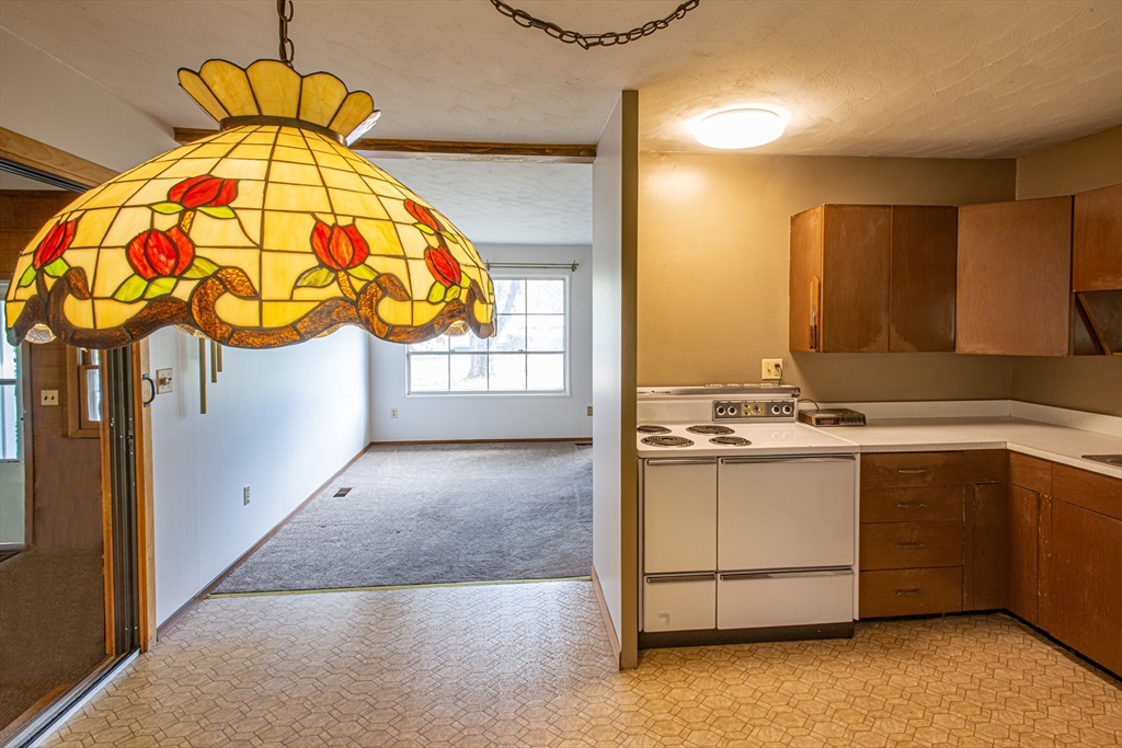 21 Dwight Street Hatfield, MA 01038 - Photo 7 of 24 a view of a kitchen with a sink and cabinets