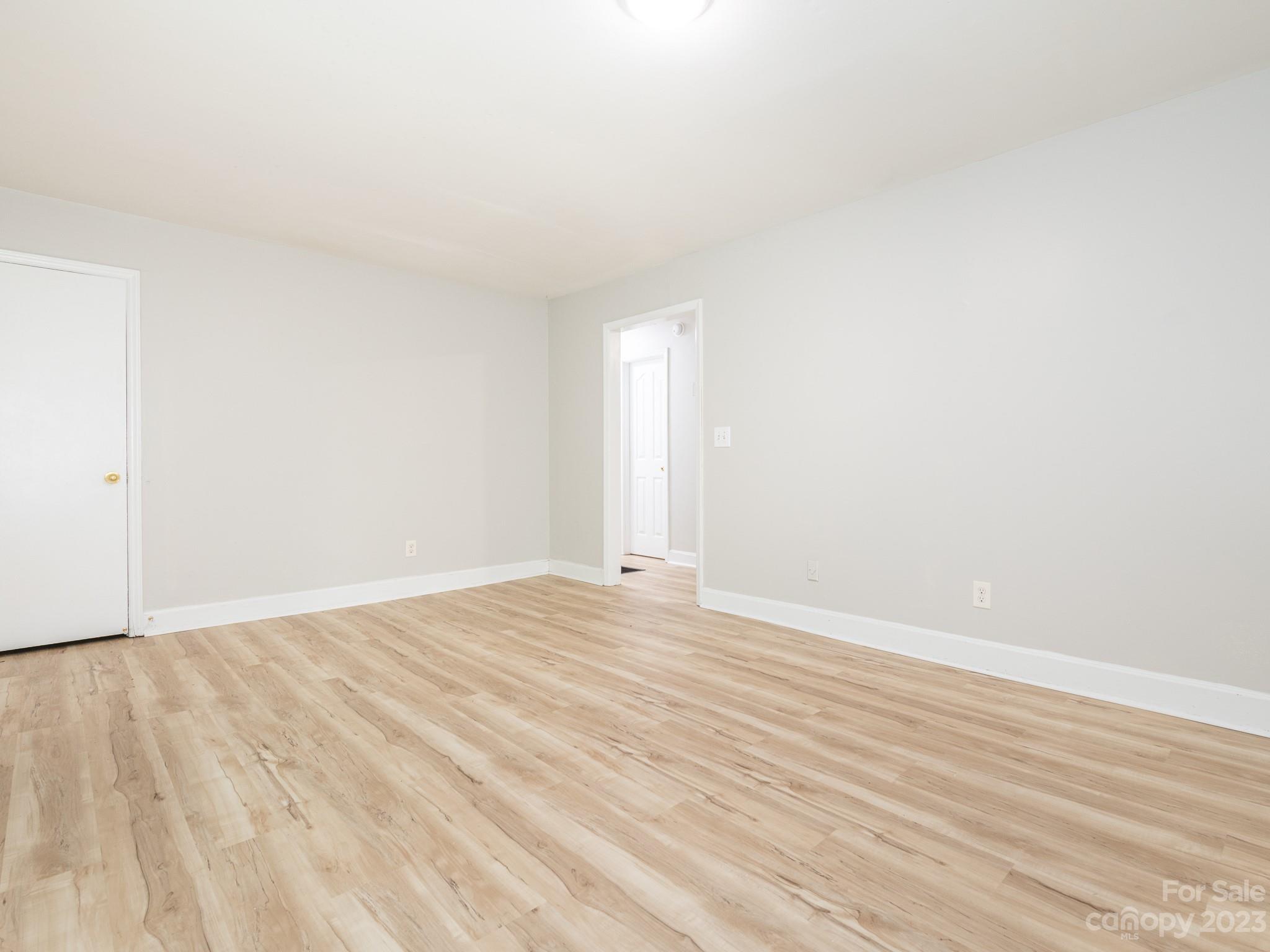 2824 Fordwood Drive Charlotte, NC 28208 - Photo 11 of 33 a view of an empty room and wooden floor