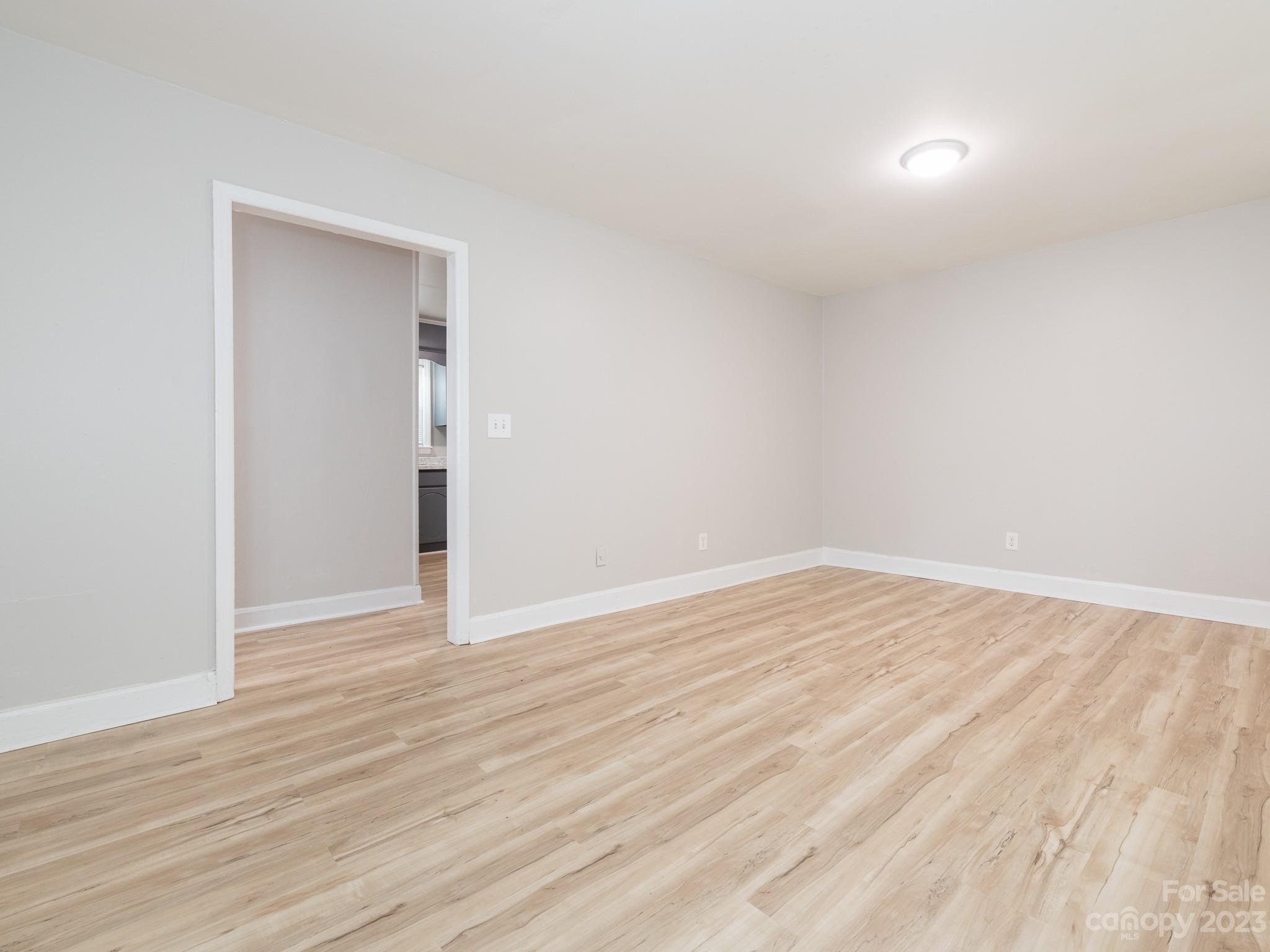 2824 Fordwood Drive Charlotte, NC 28208 - Photo 12 of 33 a view of empty room with wooden floor