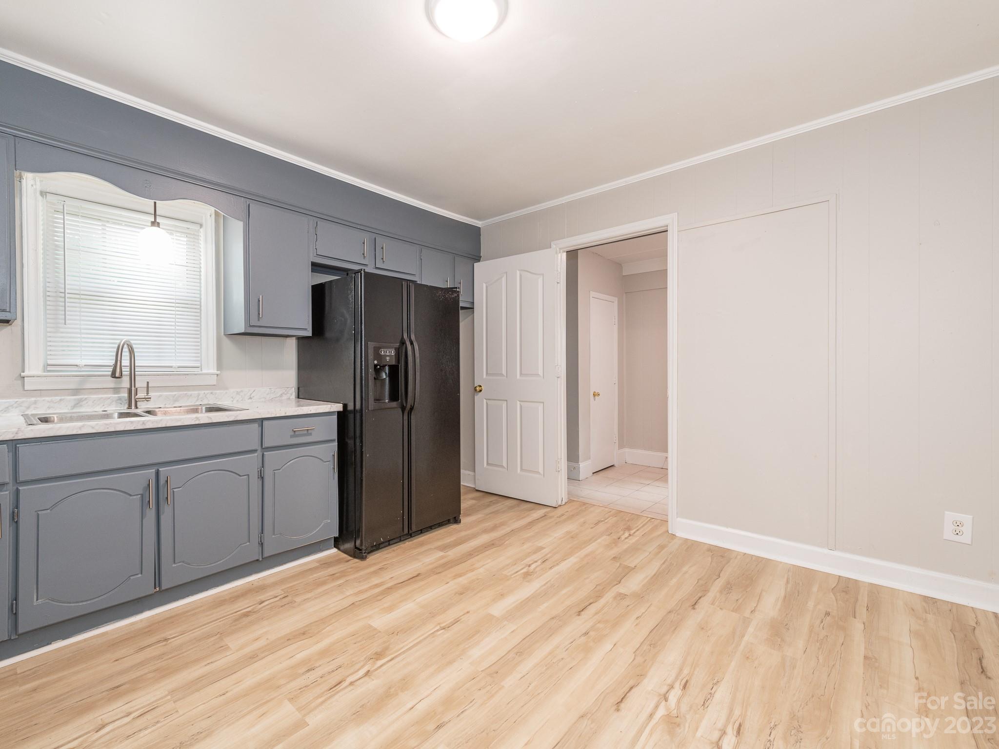 2824 Fordwood Drive Charlotte, NC 28208 - Photo 15 of 33 a kitchen with a refrigerator sink and cabinets