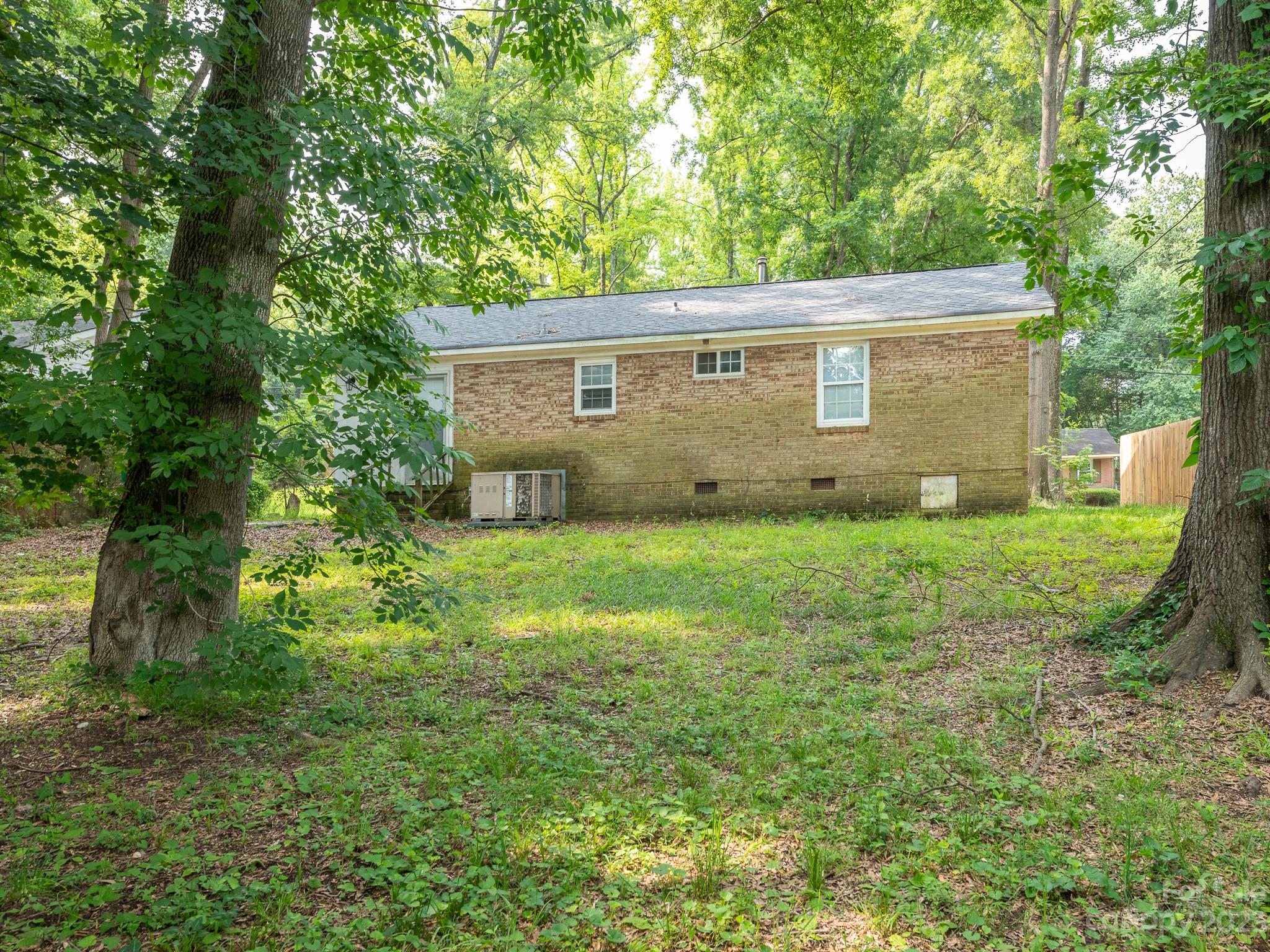 2824 Fordwood Drive Charlotte, NC 28208 - Photo 22 of 33 a view of a house with yard and a tree